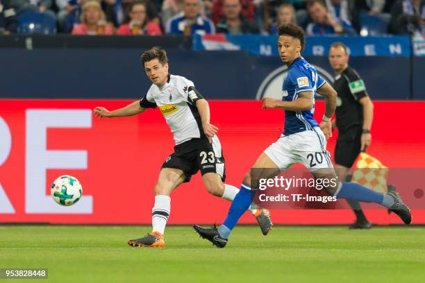 Jonas Hofmann of Moenchengladbach and Thilo Kehrer of Schalke battle for the ball during the Bundesliga match between FC Schalke 04 and Borussia...