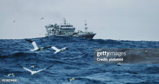 fishing boat sailing out at rough sea - north sea storm stock pictures, royalty-free photos & images