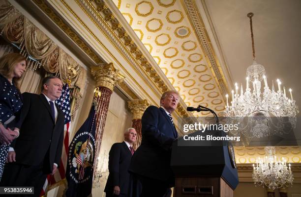 President Donald Trump, right, speaks as Susan Pompeo, from left, Mike Pompeo, U.S. Secretary of state, and U.S. Vice President Mike Pence, listen...