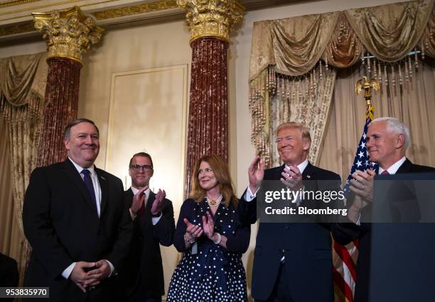 Mike Pompeo, U.S. Secretary of state, left, is applauded by U.S. Vice President Mike Pence, from right, U.S. President Donald Trump, Susan Pompeo and...