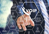 VOIP. The businessman chooses VOIP on the virtual screen in social network connection.