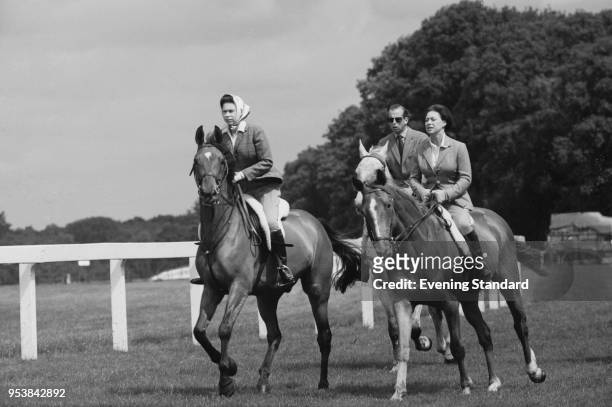 Queen Elizabeth II, Princess Margaret, Countess of Snowdon , and Prince Edward, Duke of Kent, riding at Ascot Racecourse, UK, 27th June 1968.