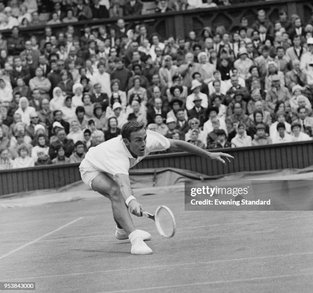 Australian tennis player John Newcombe in action at Wimbledon Championships, London, UK, 27th June 1968.