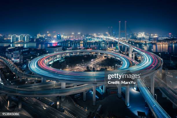 bridge traffic at night in shanghai china - urban road top view stock pictures, royalty-free photos & images