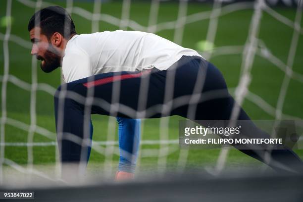 Roma's Brazilian goalkeeper Alisson warms up ahead of the UEFA Champions League semi-final second leg football match between AS Roma and Liverpool at...
