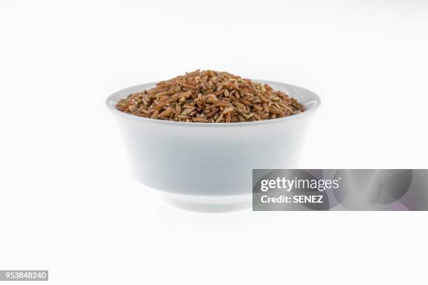 red rice directly above view, macro shot. traditional food. - brown rice stock pictures, royalty-free photos & images
