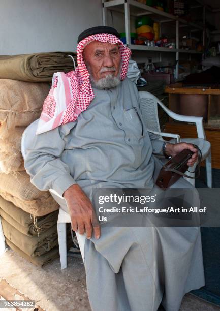 Portrait of an old saudi man wearing a kaffiyeh, Al-Jawf Province, Sakaka, Saudi Arabia on January 17, 2010 in Sakaka, Saudi Arabia.