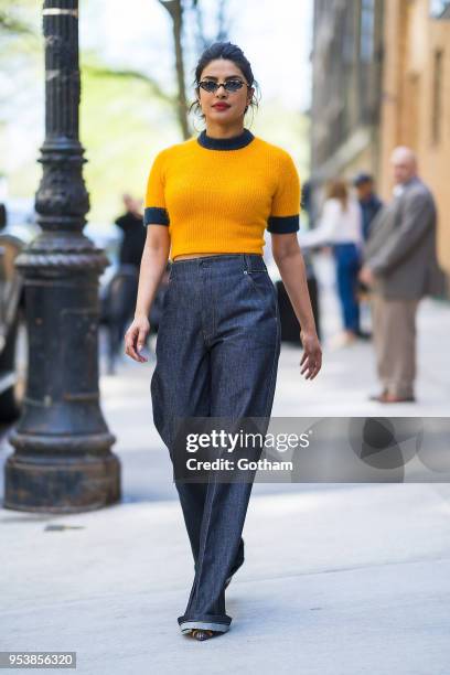 Priyanka Chopra is seen wearing a Ganni top, Frame Denim jeans and Fendi shoes with Vogue X Gigi eyewear in the Upper West Side on May 2, 2018 in New...
