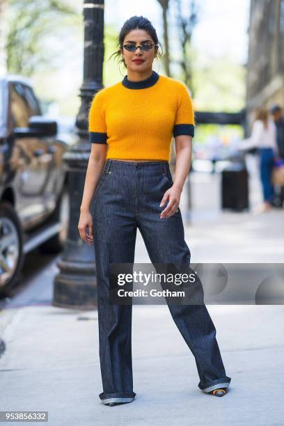 Priyanka Chopra is seen wearing a Ganni top, Frame Denim jeans and Fendi shoes with Vogue X Gigi eyewear in the Upper West Side on May 2, 2018 in New...