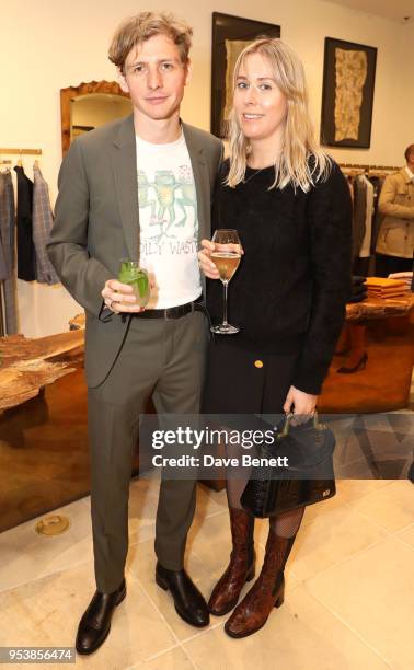 Joe Falconer and guest attend the Paul Smith x Tom Hingston 'Progress' collaboration launch party at Paul Smith Albemarle Street on May 2, 2018 in...