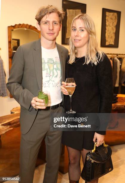 Joe Falconer and guest attend the Paul Smith x Tom Hingston 'Progress' collaboration launch party at Paul Smith Albemarle Street on May 2, 2018 in...