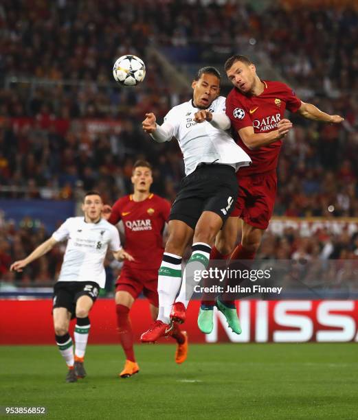 Virgil van Dijk of Liverpool and Edin Dzeko of AS Roma clash during the UEFA Champions League Semi Final Second Leg match between A.S. Roma and...