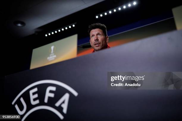 Diego Simeone, Head coach of Atletico Madrid speaks during a press conference held with team's player Diego Godin ahead of the UEFA Europa League...