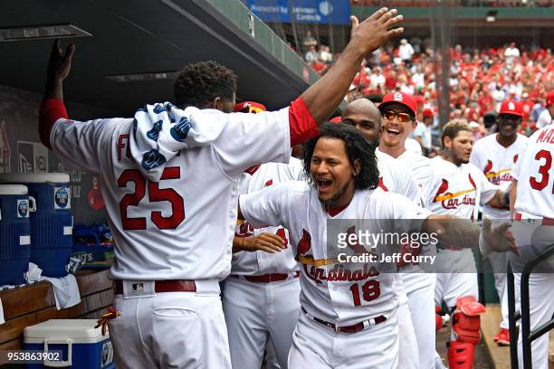 Carlos Martinez of the St. Louis Cardinals celebrates with Dexter Fowler after hitting a solo home run during the sixth inning against the Chicago...