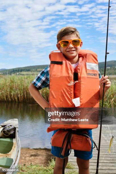 father and son fishing trip - life jacket isolated stock pictures, royalty-free photos & images