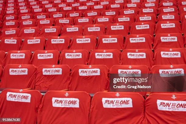Closeup view of tee shirts that read RUN AS ONE on courtside seats before Houston Rockets vs Minnesota Timberwolves game at Toyota Center. Game 2....