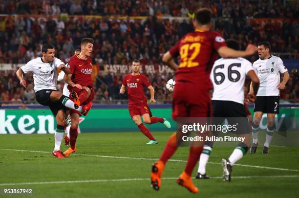 Dejan Lovren of Liverpool clears the ball which later rebounds off of James Milner of Liverpool leading to him scoring an own goal during the UEFA...