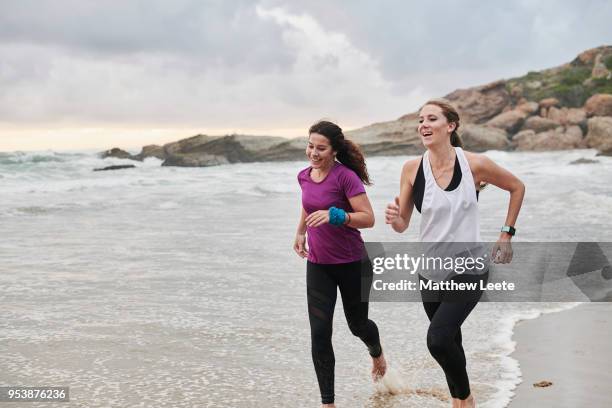 beach runners - beach sports stock pictures, royalty-free photos & images