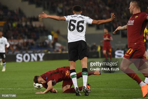 Liverpool's English midfielder Trent Alexander-Arnold reacts after a chellange with Roma's Italian striker Stephan El Shaarawy during the UEFA...