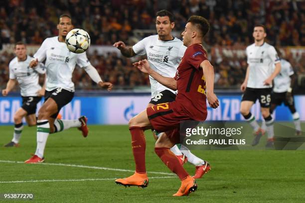 Liverpool's Croatian defender Dejan Lovren vies with Roma's Italian striker Stephan El Shaarawy during the UEFA Champions League semi-final second...
