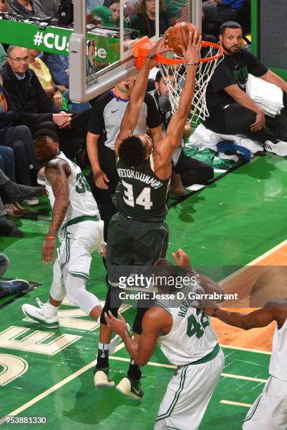 Giannis Antetokounmpo of the Milwaukee Bucks dunks the balll against the Boston Celtics in Game Seven of the 2018 NBA Playoffs on April 28, 2018 at...