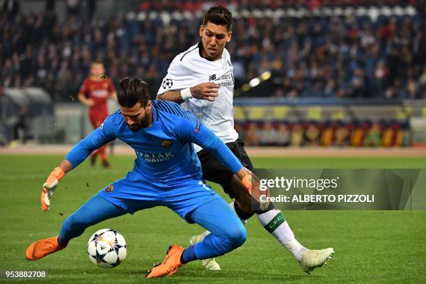 Liverpool's Brazilian midfielder Roberto Firmino vies Roma's Brazilian goalkeeper Alisson during the UEFA Champions League semi-final second leg...
