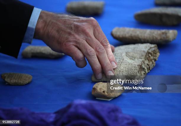 Ancient artifacts, smuggled into the U.S. In violation of federal law and shipped to Hobby Lobby stores, are shown at an event returning the...