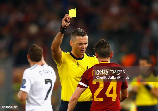Alessandro Florenzi of AS Roma is shown a yellow card during the UEFA Champions League Semi Final Second Leg match between A.S. Roma and Liverpool at...