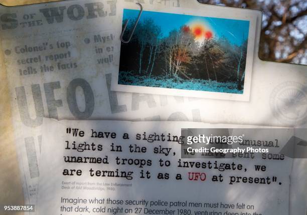 Newspaper headline reports on notice sign at Rendlesham UFO trail, Rendlesham forest, Suffolk, England, UK.