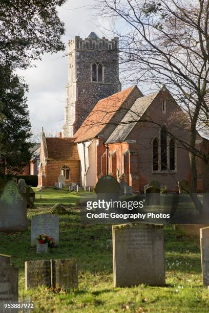 Graves in churchyard of village church, Bromeswell, Suffolk, England, UK.