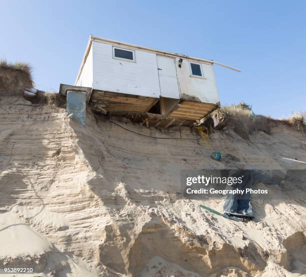 March 2018, Clifftop property collapsing due to coastal erosion after recent storm force winds, Hemsby, Norfolk, England, UK.