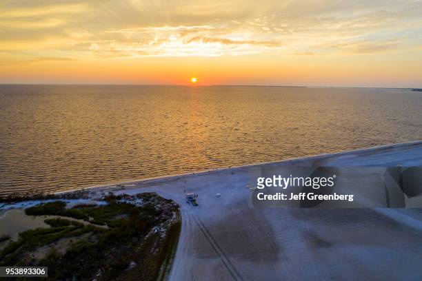 Florida, Fort Myers Beach, Estero Island, Gulf of Mexico, aerial view beach and ocean at sunset.
