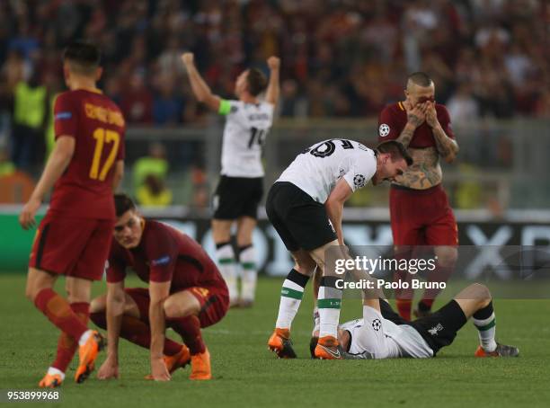 Liverpool players celebrate as AS Roma players show their dejection after the UEFA Champions League Semi Final Second Leg match between A.S. Roma and...