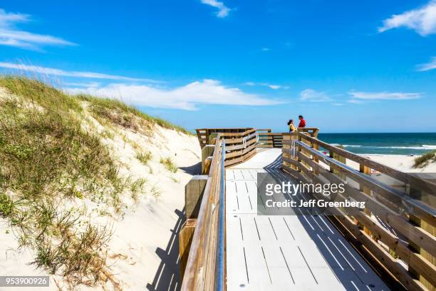 North Carolina, Cape Hatteras National Seashore, boardwalk to beach with sand dunes.