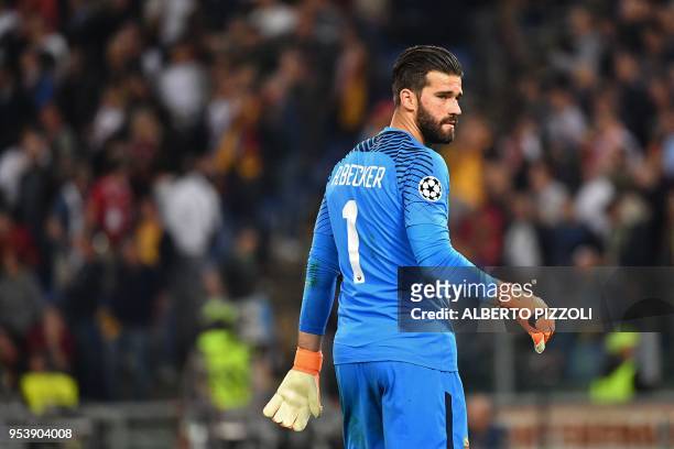 Roma's Brazilian goalkeeper Alisson looks on after being defeated by Liverpool at the end of the UEFA Champions League semi-final second leg football...