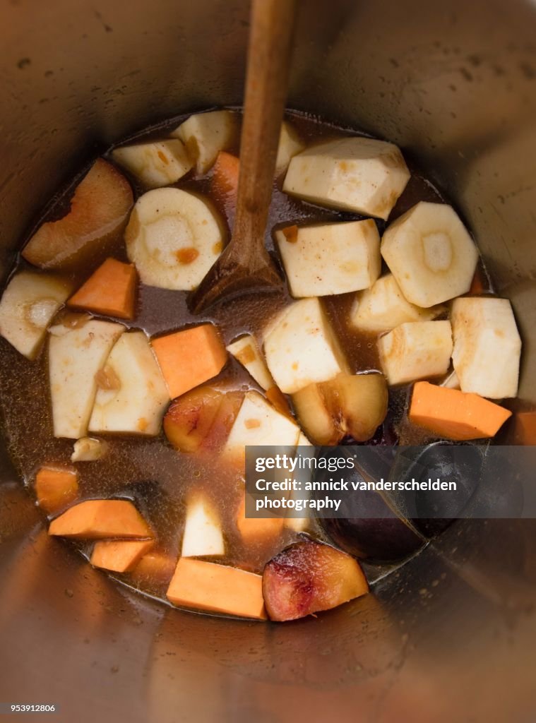Pressure cooker pan with vegetables and beef gravy.