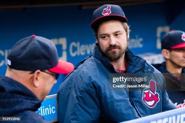 Manager Terry Francona of the Cleveland Indians talks to pitcher Andrew Miller in the dugout prior to the game against the Chicago Cubs at...