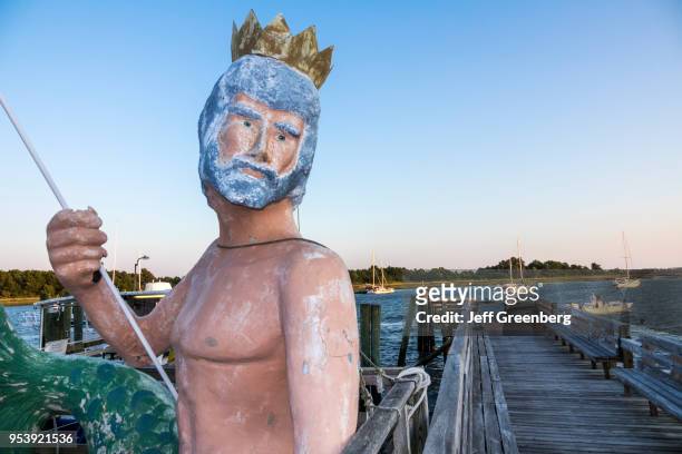 North Carolina, Morehead City, Bogue Sound, Olympus Dive Center, Poseidon statue and pier.