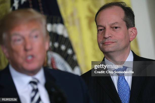 Labor Secretary Alexander Acosta listens to President Donald Trump deliver brief remarks during the award ceremony for National Teacher of the Year...