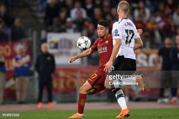 Cengiz Under of AS Roma in action against Ragnar Klavan of Liverpool during the UEFA Champions League semi final return match between AS Roma and...