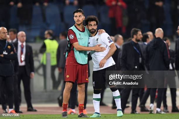 Lorenzo Pellegrini of AS Roma and Mohamed Salah of Liverpool FC hug each other at the end of the UEFA Champions League semi final return match...