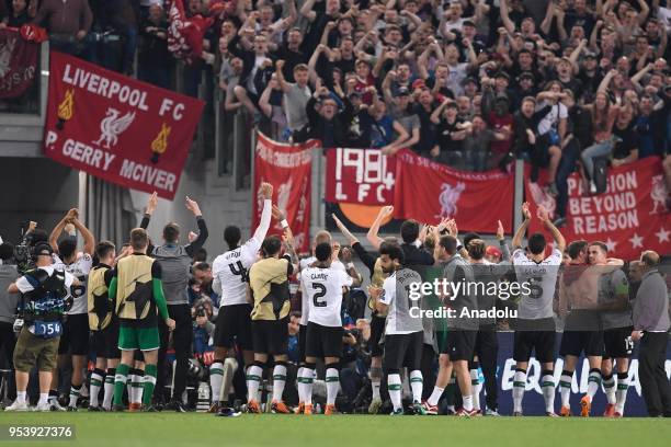 Football players of Liverpool FC celebrate their victory at the end of the UEFA Champions League semi final return match between AS Roma and...