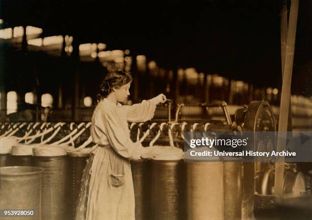 Girl Working at Slubber Machines, Lincoln Cotton Mills, Evansville, Indiana, USA, Lewis Hine for National Child Labor Committee, October 1908.