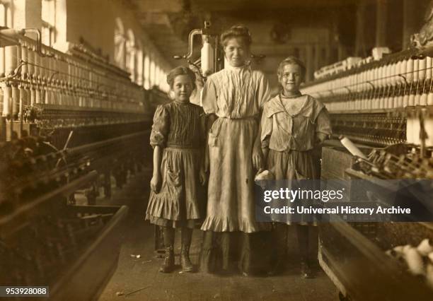 Three Young Workers, Girl on Left said she was 10 years old, girl on Right said she was 12, Rhodes Manufacturing Company, Lincolnton, North Carolina,...