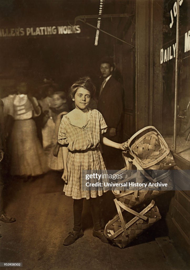 Antoinette Siminger, 12 years old, Selling Baskets at Sixth Street Market at 10:00 p.m., Full-Length Portrait, Cincinnati, Ohio, USA, Lewis Hine for National Child Labor Committee, August 1908