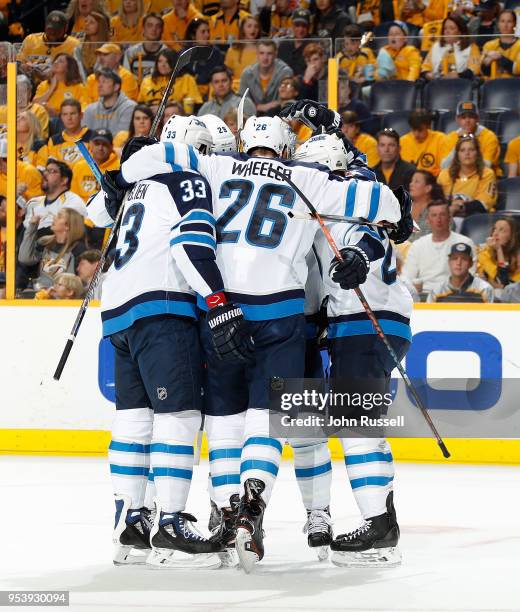 Blake Wheeler and Dustin Byfuglien of the Winnipeg Jets celebrate a goal against the Nashville Predators in Game Two of the Western Conference Second...
