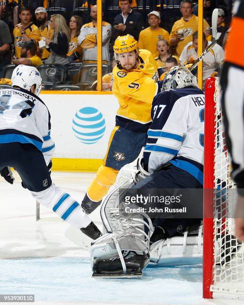 Filip Forsberg of the Nashville Predators shoots the puck against Connor Hellebuyck of the Winnipeg Jets in Game Two of the Western Conference Second...