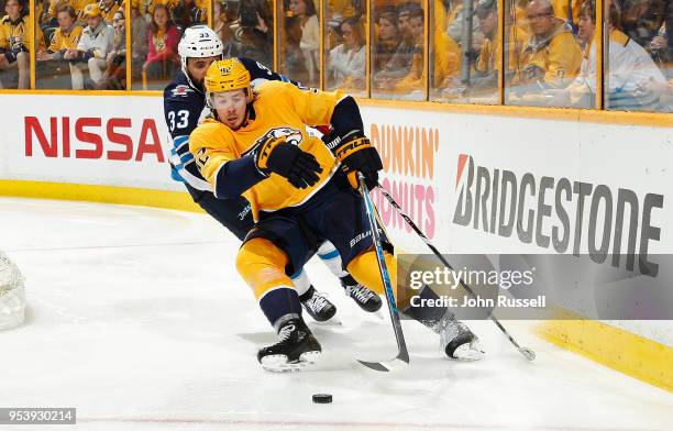 Ryan Johansen of the Nashville Predators skates against Dustin Byfuglien of the Winnipeg Jets in Game Two of the Western Conference Second Round...