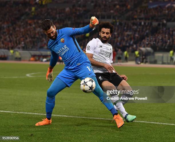 Mohamed Salah of Liverpool competes with Alisson Becker of A.S. Roma during the UEFA Champions League Semi Final Second Leg match between A.S. Roma...