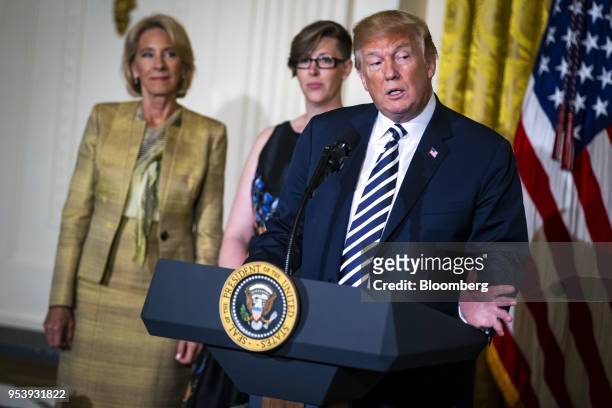 President Donald Trump speaks as Betsy DeVos, U.S. Secretary of education, left, and Mandy Manning, National Teacher of the Year award recipient,...